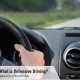 What is Defensive Driving? - showing hands on steering wheel and view of car dash
