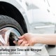 Inflating your Tires with Nitrogen - hand adding air a car tire